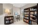 Charming office space with custom shelving, work desk and serene window view at 424 Paperbark Ln, Rock Hill, SC 29732