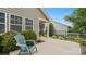 Relaxing open patio with a comfortable chair and privacy provided by lush greenery at 424 Paperbark Ln, Rock Hill, SC 29732