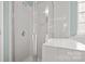 Modern bathroom showcasing a white tiled shower with frameless glass door enclosure at 424 Paperbark Ln, Rock Hill, SC 29732