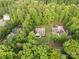 Aerial shot showcasing the home surrounded by lush greenery in a peaceful neighborhood at 481 Evergreen Rd, Clover, SC 29710