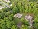 Aerial view of a home nestled among green trees in a residential neighborhood at 481 Evergreen Rd, Clover, SC 29710