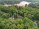 Breathtaking aerial shot of a property near the lake, surrounded by lush trees, highlighting its peaceful location at 481 Evergreen Rd, Clover, SC 29710