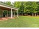 Spacious backyard with a covered patio, perfect for outdoor entertaining and enjoying the green surroundings at 481 Evergreen Rd, Clover, SC 29710