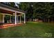 Lush backyard with covered patio, ideal for outdoor dining, recreation, and enjoying the natural surroundings at 481 Evergreen Rd, Clover, SC 29710