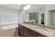Bathroom featuring double sinks, granite countertops, and bathtub at 481 Evergreen Rd, Clover, SC 29710