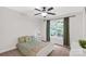 Bright bedroom featuring a ceiling fan, large window, and neutral color palette at 481 Evergreen Rd, Clover, SC 29710