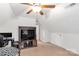 Attic bedroom featuring a television, decor, and sloped ceilings at 481 Evergreen Rd, Clover, SC 29710