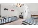 Upstairs bedroom featuring two twin beds, ceiling fan, and decor at 481 Evergreen Rd, Clover, SC 29710