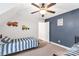 Upstairs bedroom with two beds, ceiling fan, and playful wall decorations at 481 Evergreen Rd, Clover, SC 29710