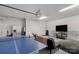 The game room is equipped with a ping pong table, TV, comfortable seating, and a convenient refrigerator at 481 Evergreen Rd, Clover, SC 29710