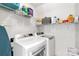Functional laundry room featuring a washer, dryer, and shelving units at 481 Evergreen Rd, Clover, SC 29710