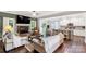 Spacious open-concept living area featuring hardwood floors, a fireplace, and seamless access to kitchen at 481 Evergreen Rd, Clover, SC 29710