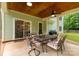Covered patio featuring a dining table, chairs, ceiling fan and a view of the backyard at 481 Evergreen Rd, Clover, SC 29710
