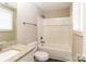 Full bathroom with granite countertop, shower over tub with white tiles and gray bronze accents at 515 Kings Mountain St, Clover, SC 29710