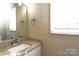 Bathroom vanity with white cabinet, granite countertop, decorative sink, and silver hardware at 515 Kings Mountain St, Clover, SC 29710