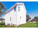 Side exterior view of a two story white house with green yard and blue skies in the background at 515 Kings Mountain St, Clover, SC 29710