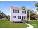 Charming two-story home with a well-manicured lawn, new walkway, and inviting front entrance at 515 Kings Mountain St, Clover, SC 29710
