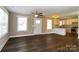 Inviting open-concept living space with hardwood floors flowing into the kitchen with ample lighting at 515 Kings Mountain St, Clover, SC 29710