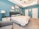 Large bedroom with a seating area, ceiling fan, and natural light at 5432 Kinsbridge Dr, Charlotte, NC 28227