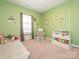 Cozy bedroom with closet, window and neutral carpet at 5432 Kinsbridge Dr, Charlotte, NC 28227