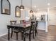 Charming dining area adjacent to a kitchen with granite countertops and stainless steel appliances at 5432 Kinsbridge Dr, Charlotte, NC 28227