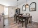 Bright dining room with modern lighting and access to front door at 5432 Kinsbridge Dr, Charlotte, NC 28227