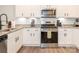 Close up view of modern kitchen stainless steel appliances and granite counters at 5432 Kinsbridge Dr, Charlotte, NC 28227