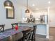 Bright kitchen featuring white cabinets and modern stainless steel appliances at 5432 Kinsbridge Dr, Charlotte, NC 28227