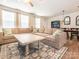 Spacious living room with large sectional couch and dining room view at 5432 Kinsbridge Dr, Charlotte, NC 28227