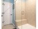 Tiled shower with glass door and built-in seat at 5432 Kinsbridge Dr, Charlotte, NC 28227