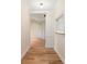 Inviting hallway with hardwood floors, neutral paint, and decorative molding at 5601 Fairview Rd # 11, Charlotte, NC 28209
