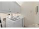 Functional laundry room with a washer, dryer, and built-in cabinetry at 5601 Fairview Rd # 11, Charlotte, NC 28209