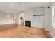 Bright living room with hardwood floors, fireplace, and built-in shelving at 5601 Fairview Rd # 11, Charlotte, NC 28209