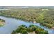 Aerial view of the lake, with tree-lined shore and docks along the perimeter at 6719 Love Point Rd, Denver, NC 28037