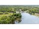 An aerial view capturing the community with its lake, lush greenery, and docks at 6719 Love Point Rd, Denver, NC 28037