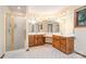 Large bathroom with dual vanities, walk-in shower, and ample lighting, offering functionality and comfort at 6719 Love Point Rd, Denver, NC 28037