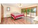 Cozy bedroom with a lake view, access to a private balcony and a classic ceiling fan at 6719 Love Point Rd, Denver, NC 28037