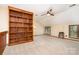 Spacious bonus room features a large bookshelf, neutral carpet, and natural light from the windows at 6719 Love Point Rd, Denver, NC 28037