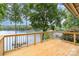 Wooden deck with lake view, showcasing the outdoor living space and scenic surroundings at 6719 Love Point Rd, Denver, NC 28037