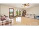 Comfortable living room with lake views and a vintage organ, blending relaxation with nostalgia at 6719 Love Point Rd, Denver, NC 28037