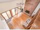 Open living room with a brick fireplace, vaulted ceilings, and access to a deck, creating a warm and inviting space at 6719 Love Point Rd, Denver, NC 28037