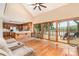 Spacious living room with hardwood floors, lake views, vaulted ceilings, and an open layout to the kitchen at 6719 Love Point Rd, Denver, NC 28037