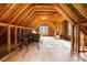 A finished attic boasts natural light, ample space, and charming architectural details for versatile use at 7101 Weavers Run, Cramerton, NC 28032
