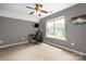 Bedroom with a gray color scheme and a view of the backyard at 7101 Weavers Run, Cramerton, NC 28032