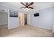 A cozy bedroom with carpet and a ceiling fan at 7101 Weavers Run, Cramerton, NC 28032