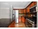 Well-equipped kitchen featuring stainless steel appliances, granite countertops, and custom cabinets at 7101 Weavers Run, Cramerton, NC 28032