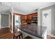 Well-equipped kitchen featuring stainless steel appliances, granite countertops, and a breakfast bar at 7101 Weavers Run, Cramerton, NC 28032