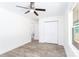 Bright bedroom featuring light gray flooring, white walls, a closet, and access to the backyard at 810 W Raleigh Ave, Statesville, NC 28677