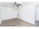 Bedroom featuring a ceiling fan, access to another room, and light gray flooring at 810 W Raleigh Ave, Statesville, NC 28677