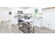 Modern kitchen with stainless steel appliances, an island with marble countertop, and white cabinetry at 810 W Raleigh Ave, Statesville, NC 28677